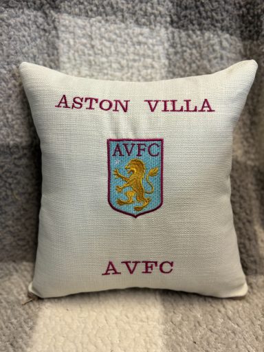 A cushion featuring the Aston Villa logo and text.