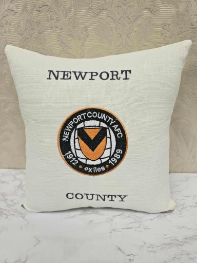Cushion featuring a logo with "Newport County" and a circular emblem design.