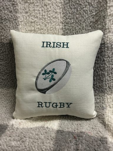 Square cushion featuring the text "Irish Rugby" and a rugby ball design.
