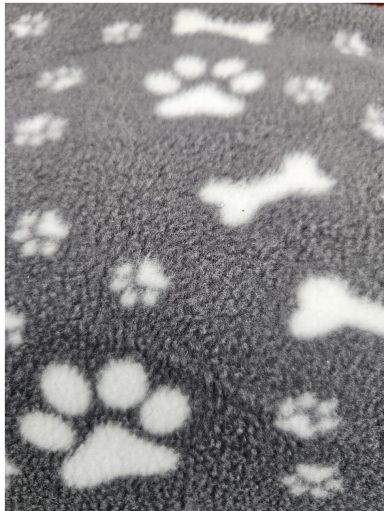 Grey fabric with white paw prints and bone patterns.