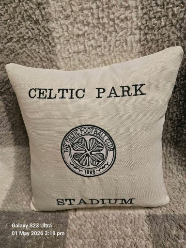 Celtic Park Stadium decorative cushion featuring a circular logo and text.