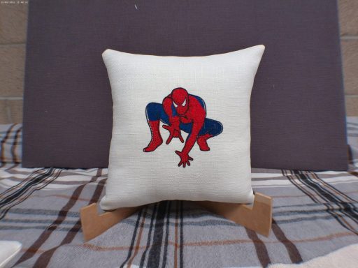 Cushion featuring a red and blue Spider-Man design on a cream background.