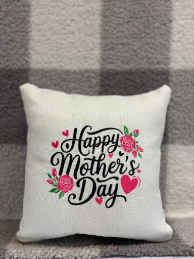 Cushion with the text "Happy Mother's Day" and floral decorations.