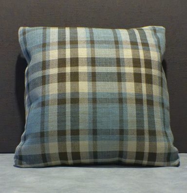 Plaid cushion in shades of blue, black, and cream, square shape.