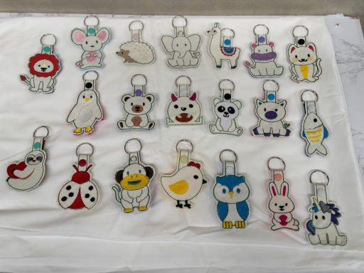 A collection of cute animal-themed keychains in various vibrant designs.