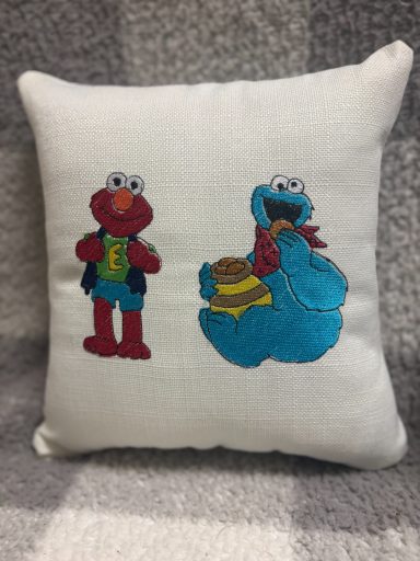 Elmo & Cookie Monster Cushion featuring Elmo and Cookie Monster characters in colourful embroidery.