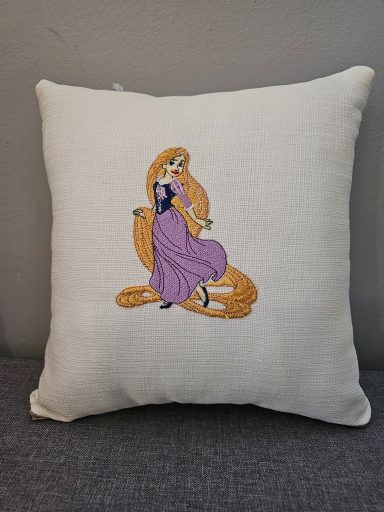 Cushion featuring a decorative illustration of a princess in a flowing dress.