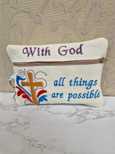 A pouch featuring the text "With God all things are possible" and a decorative cross.