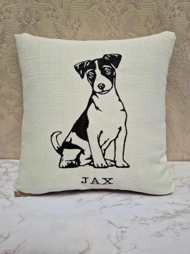 Cushion featuring a black and white illustration of a sitting dog named Jax.