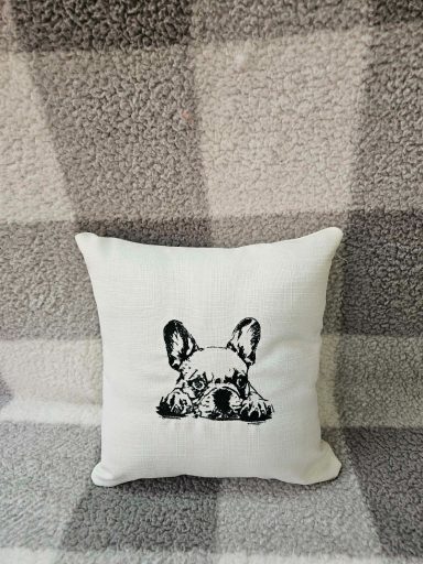 Cushion featuring a sketch of a French Bulldog on a grey patterned background.