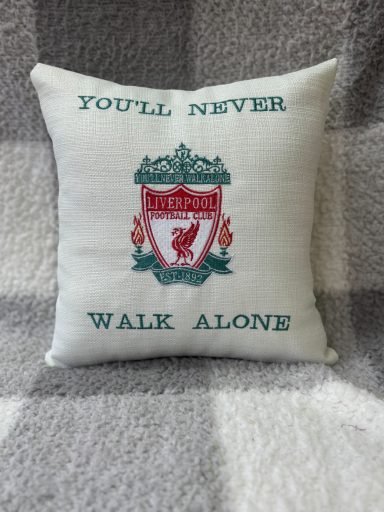 Cushion featuring the Liverpool FC crest with the text "You'll Never Walk Alone."