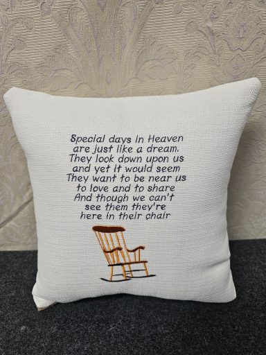A cushion featuring a poem about dreams and a rocking chair.