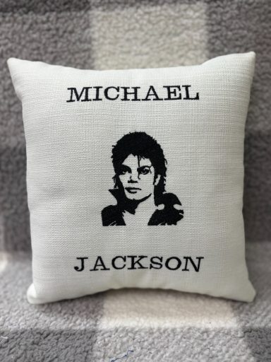Cushion featuring a black silhouette of Michael Jackson with his name above.
