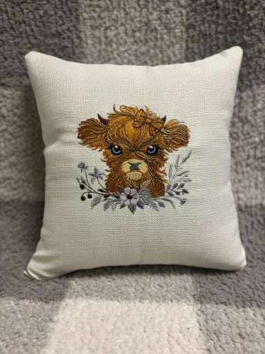 Square decorative cushion featuring an illustrated brown puppy surrounded by floral elements.