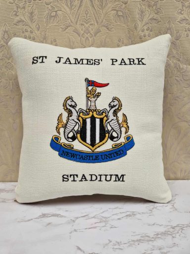 Cushion featuring the St James Park Stadium crest and name.