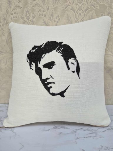 Cushion featuring a silhouette of a man's face with styled hair.