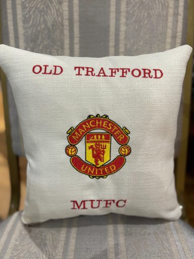 Cushion featuring the Manchester United logo and "Old Trafford" text.