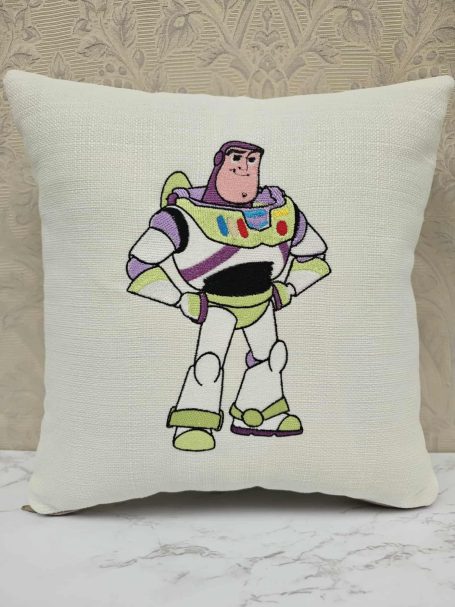 A cushion featuring a cartoon character resembling a space ranger in a bold pose.