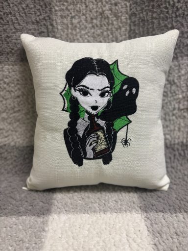 Wednesday Addams Cushion featuring a spooky girl illustration with braids and a green ghost.
