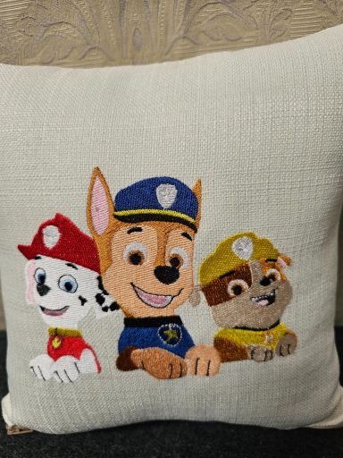 Embroidered cushion featuring three cartoon dogs: Chase, Marshall, and Rubble.