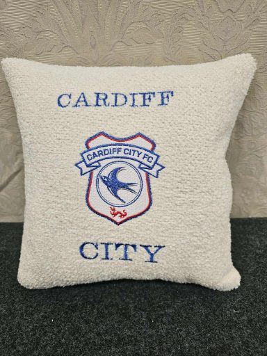 White cushion featuring the Cardiff City FC crest and the text "CARDIFF CITY."