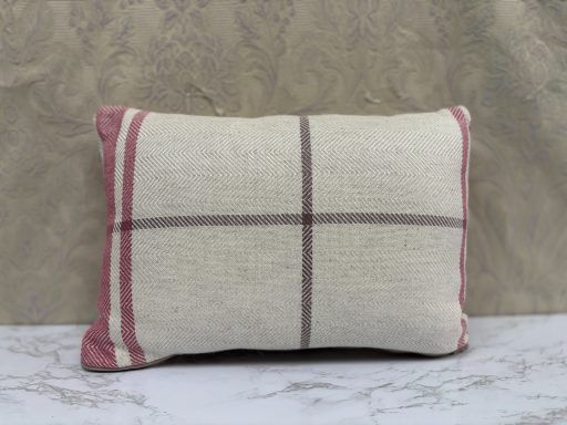 Rectangular cushion with a cream background and pink and brown stripes.