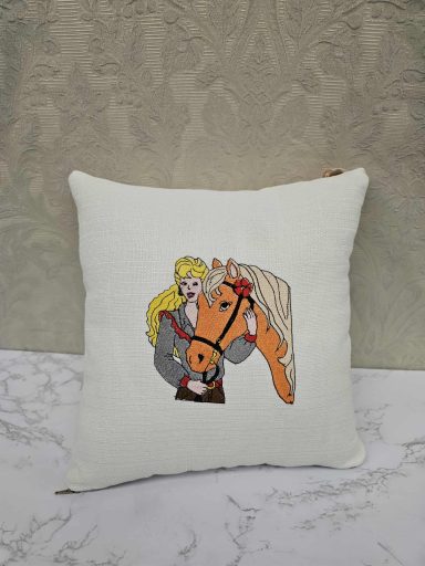 Cushion featuring a graphic of a blonde person with a horse.