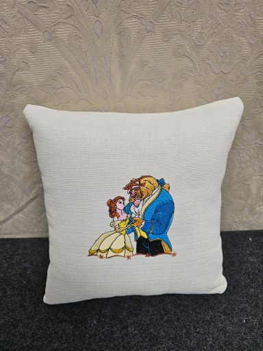 Cushion featuring Belle and the Beast from "Beauty and the Beast."