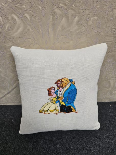 Cushion featuring Belle and the Beast from "Beauty and the Beast" in a romantic pose.
