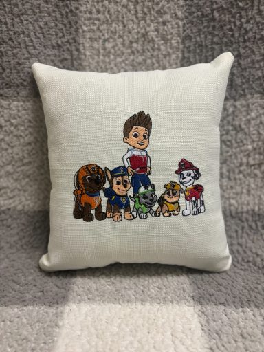 Paw Patrol Gang Decorative cushion featuring cartoon dogs and a boy character from a children's show.