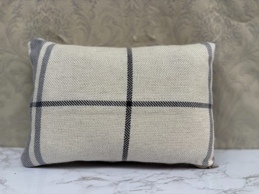 Cream cushion with grey stripes and a subtle check pattern.