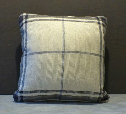 Square cushion with a grey fabric and a blue plaid pattern.