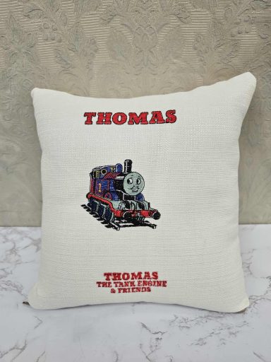Cushion featuring an illustration of Thomas the Tank Engine with the name "THOMAS" above.