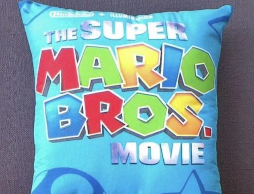 Cushion featuring colourful text promoting "The Super Mario Bros. Movie."