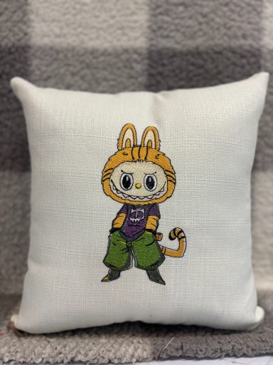 A cushion featuring a cartoon character in a cat costume with green pants.