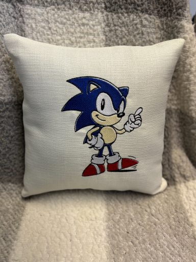 Sonic the Hedgehog character embroidered on a decorative cushion.