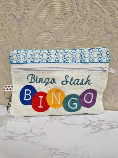 Pouch with text "Bingo Stash" and multicoloured bingo ball designs.